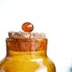 2 amber blown glass jars, cork stoppers