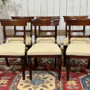 Set of 2 armchairs and 6 English mahogany chairs from the 1950s.