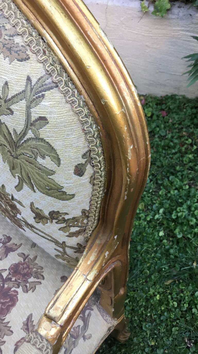 Pair of straight-backed armchairs, known as "queen's armchairs," in carved and gilded wood