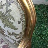 Pair of straight-backed armchairs, known as "queen's armchairs," in carved and gilded wood