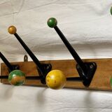 Coat rack with 5 double metal hooks and vintage wooden balls from the 1950s.