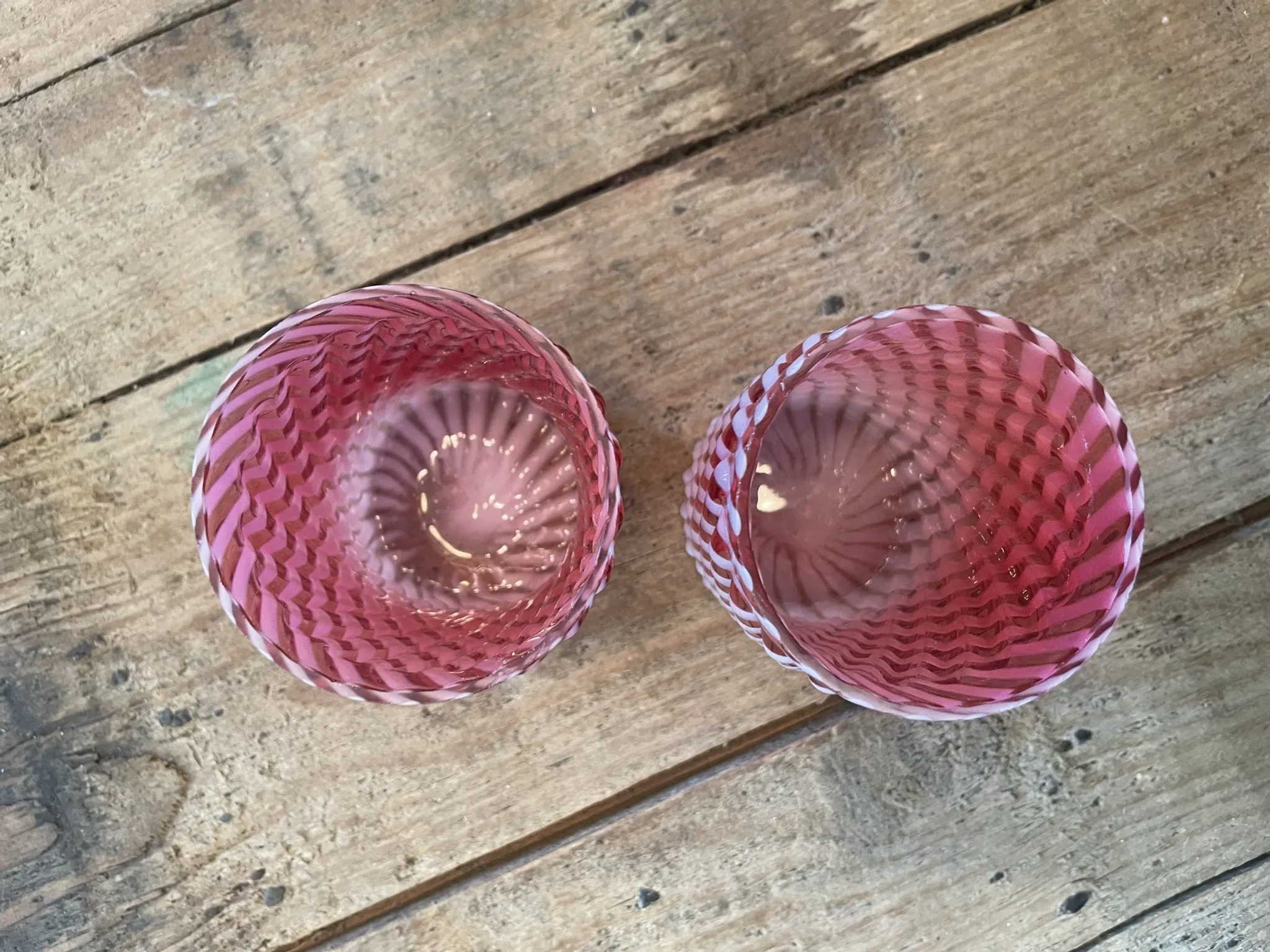 Two Northwood glasses from the 1930s in opalescent pink glass.
