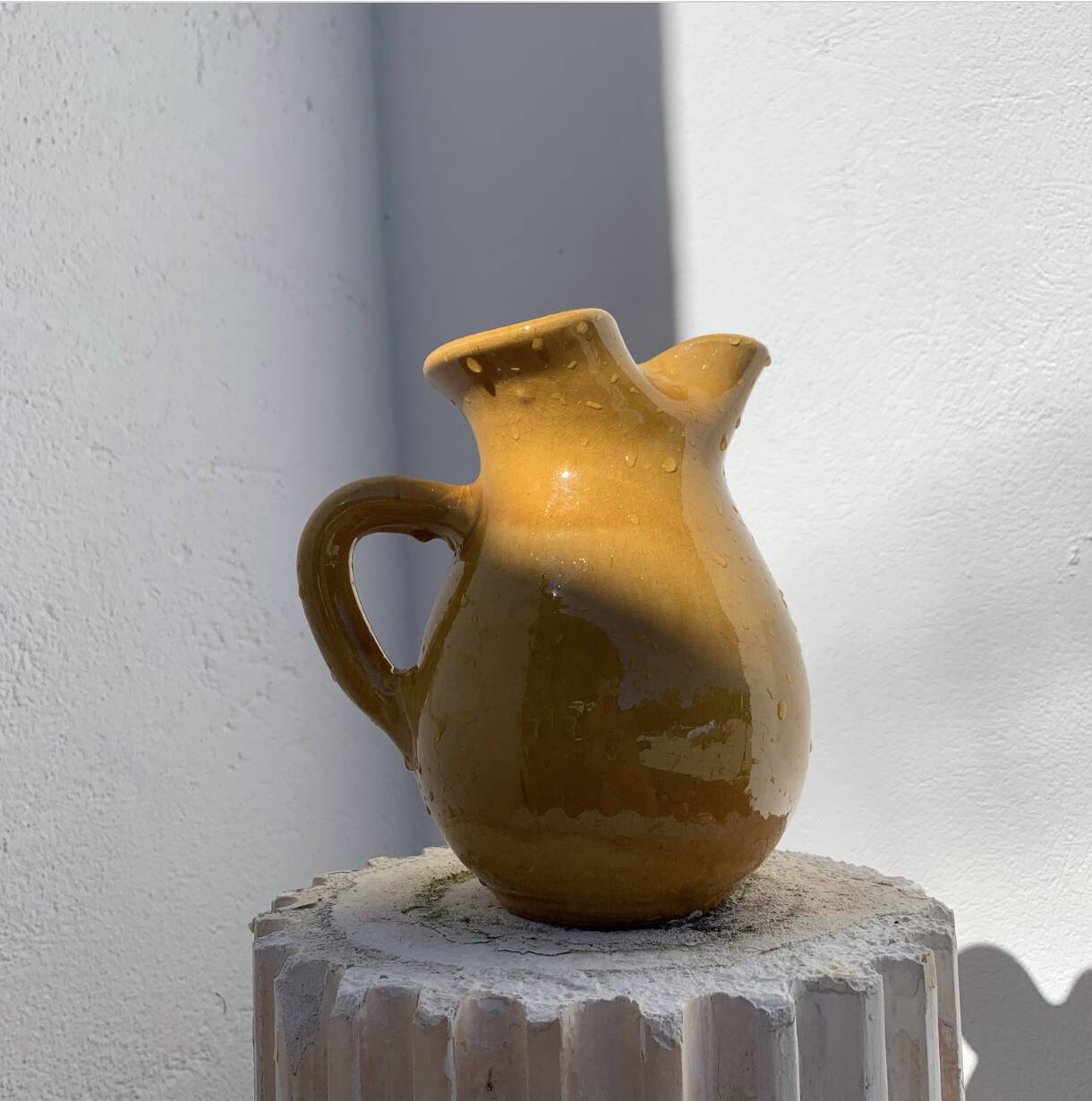 Large vintage artisanal glazed earthenware pitcher with pinched spout