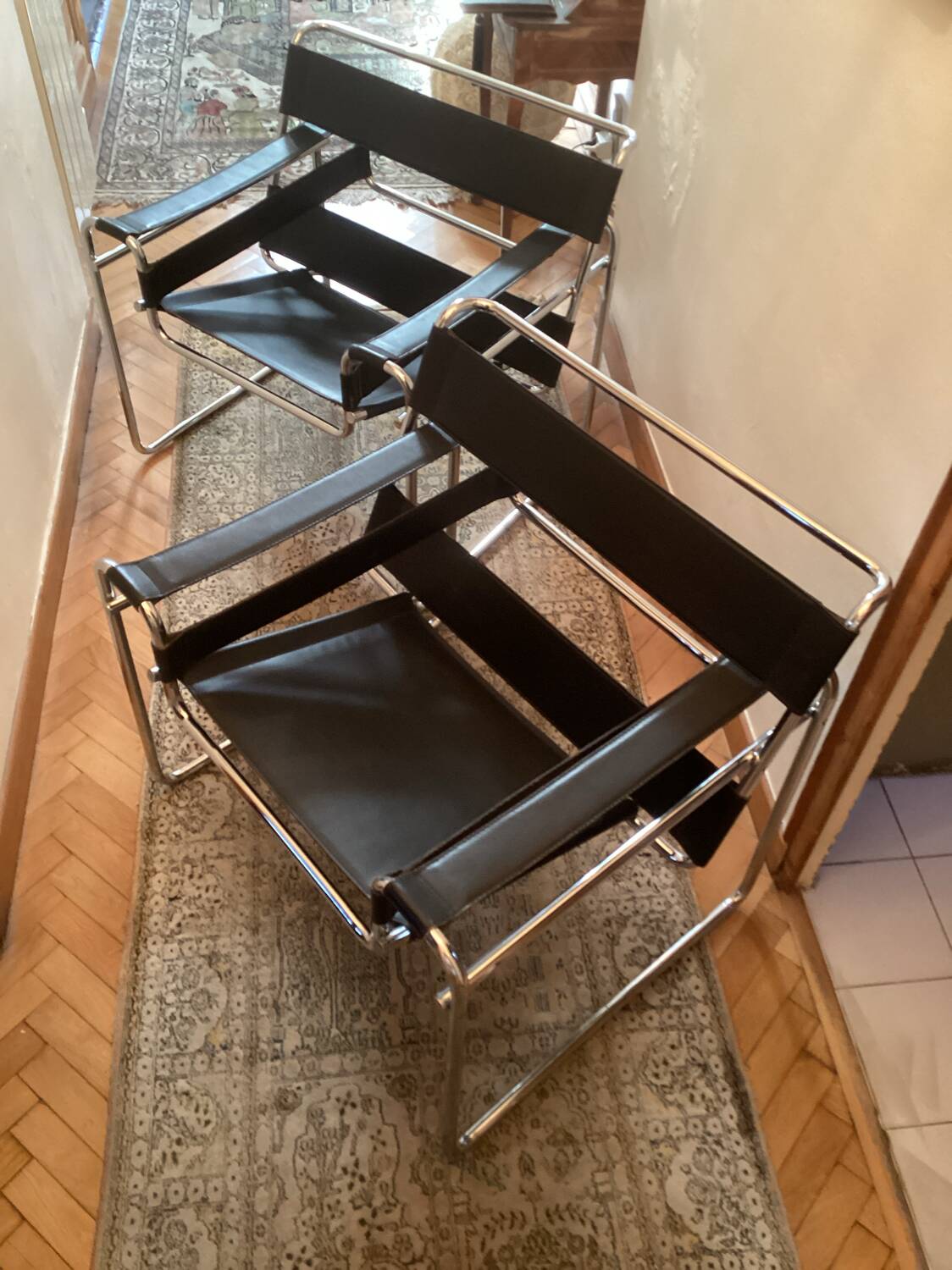 Pair of Wassily black leather armchairs