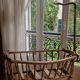 Wooden cradle in walnut with a sign collar at the top.