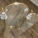 Vintage triptych mirror in brass with wall lights.