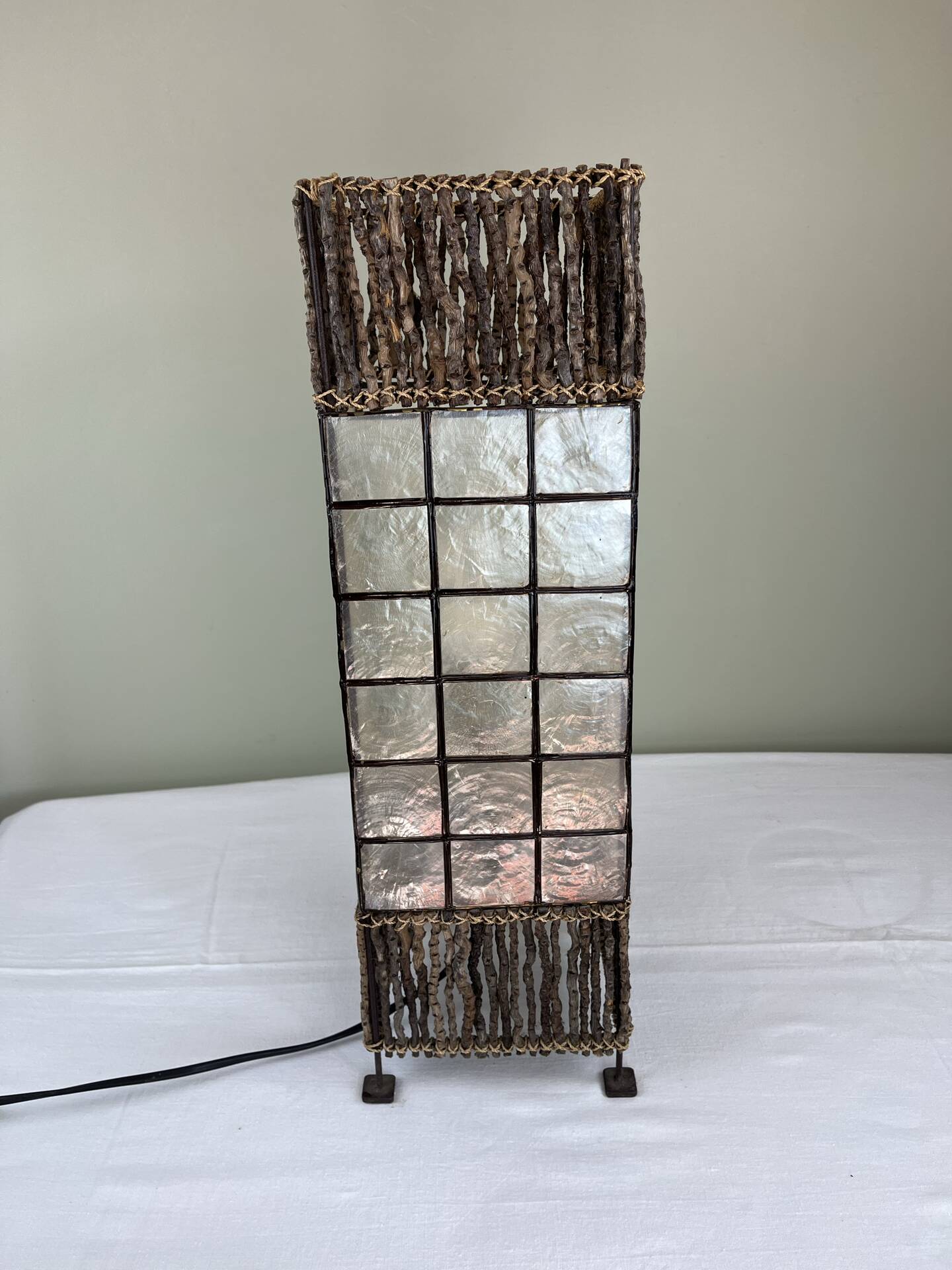 Capiz shell lamp and woven twigs