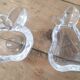 Set of 2 crystal ashtrays in apple and pear shapes.