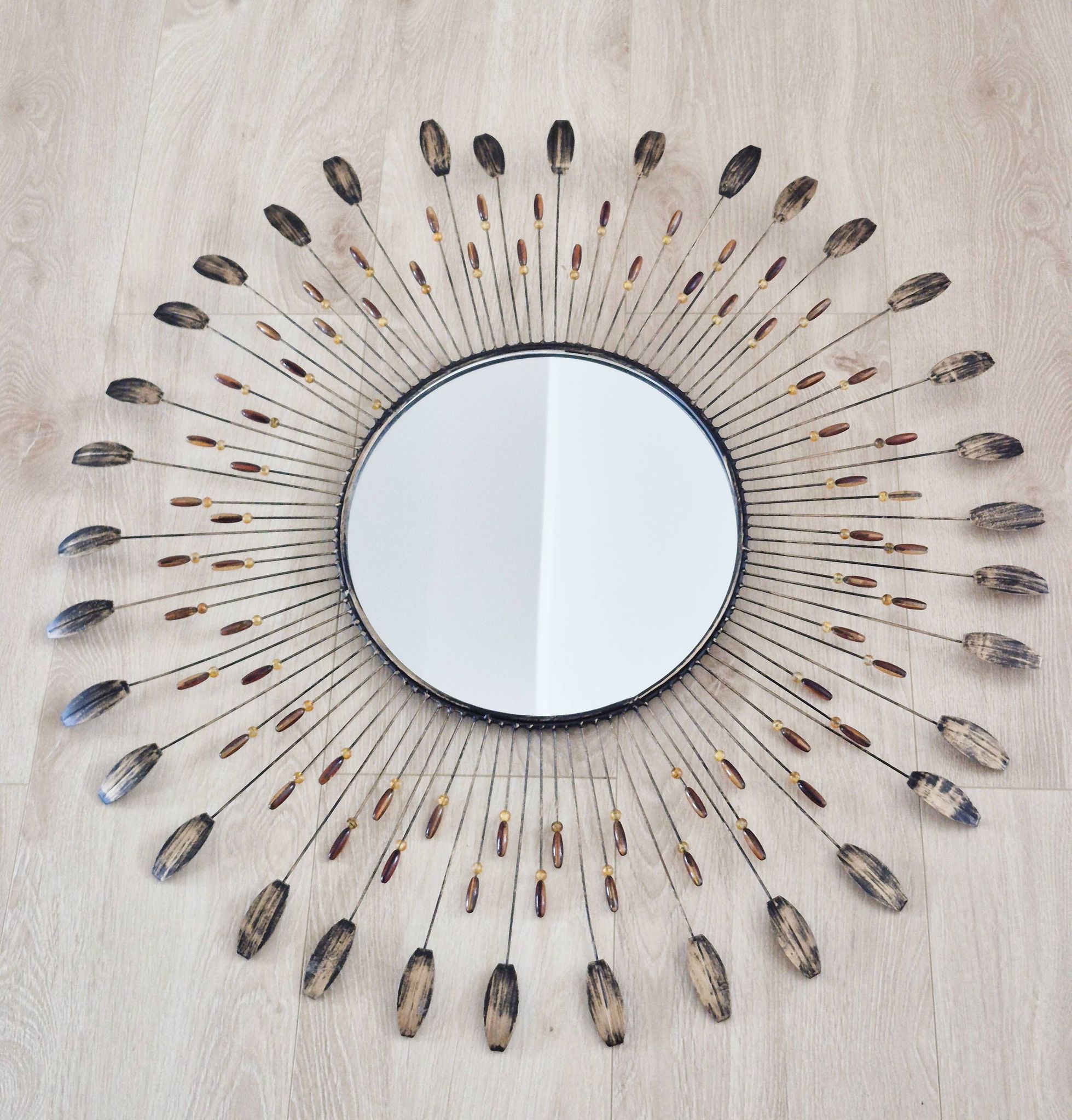 Vintage metal sun mirror in the style of Line Vautrin