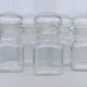 Lot de cinq pots d'apothicaire en verre transparent