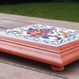 Underside of flat wood and faience floral pattern - retro