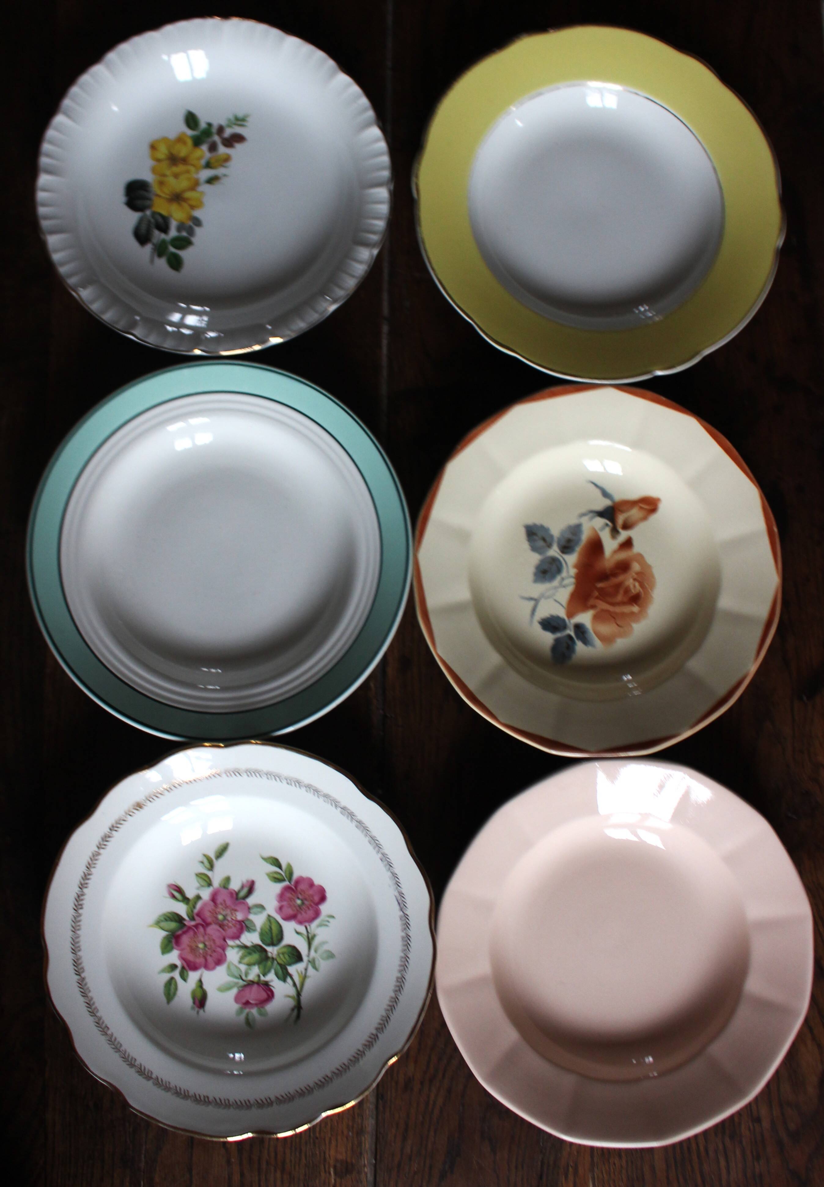 6 mismatched deep plates in floral colours from Digoin, Sarreguemines, Gien.