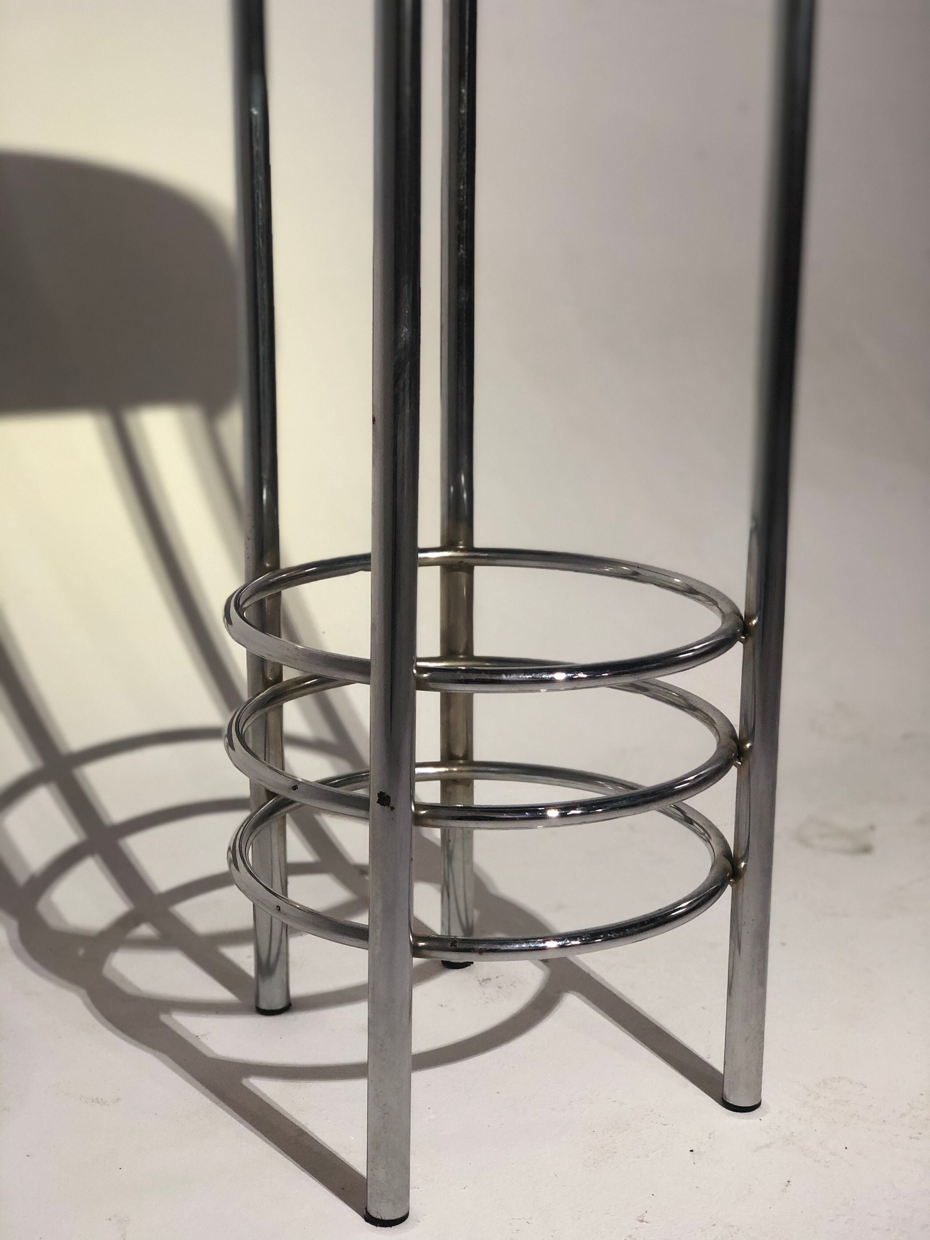 Contemporary aluminum stool and green/blue velvet