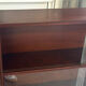 Vintage 1960s wooden library with sliding doors.