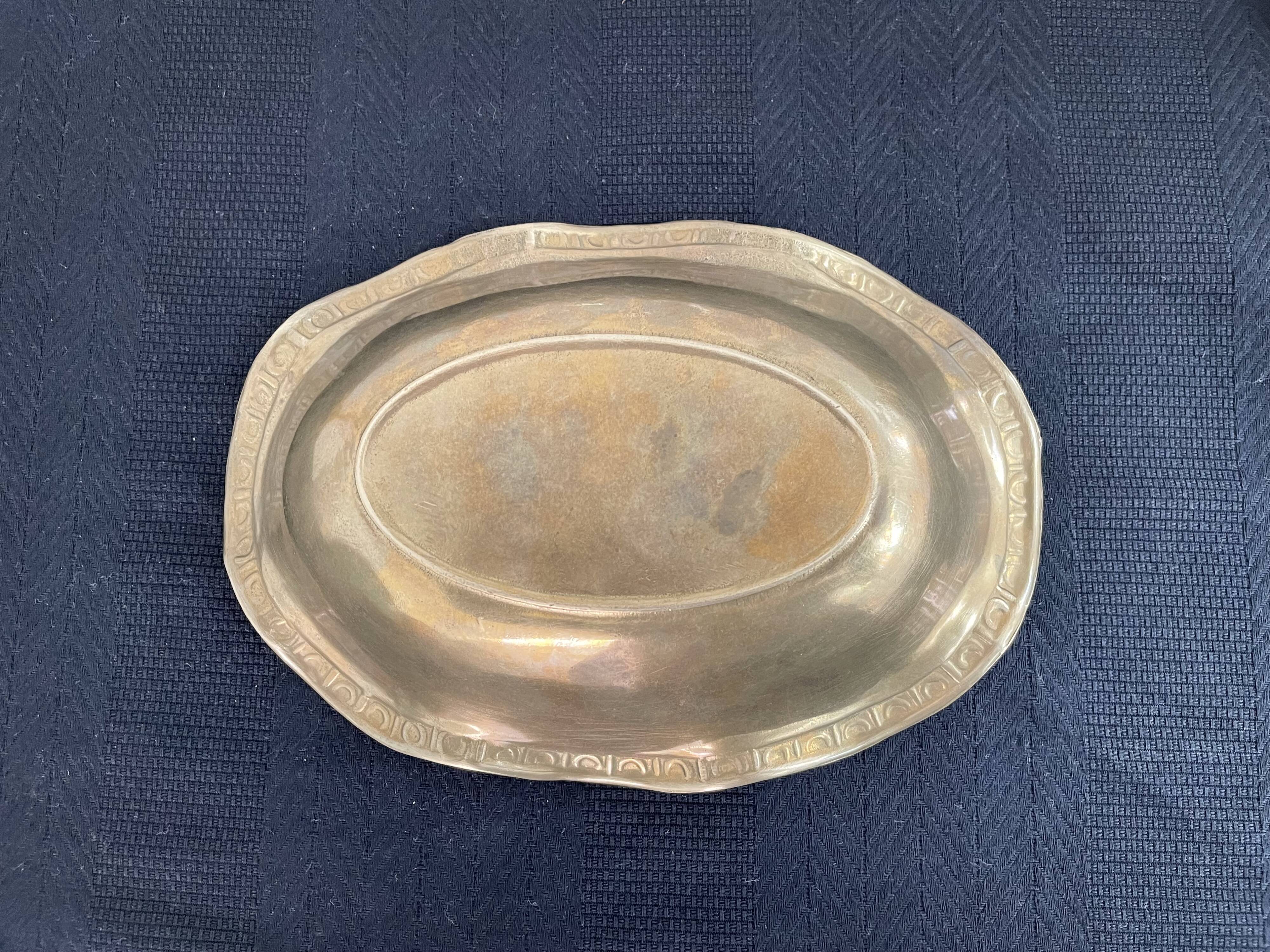 Antique hammered brass cup - pocket empty - golden - frieze