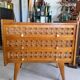 Vintage wooden and rattan chest of drawers with tapered legs.