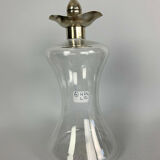 Blown glass carafe with silver frame and cap