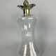 Blown glass carafe with silver frame and cap