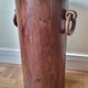 Art Deco umbrella stand in walnut with staves and ring handles, 1930.