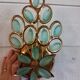 Gold metal wall light with light blue tassels