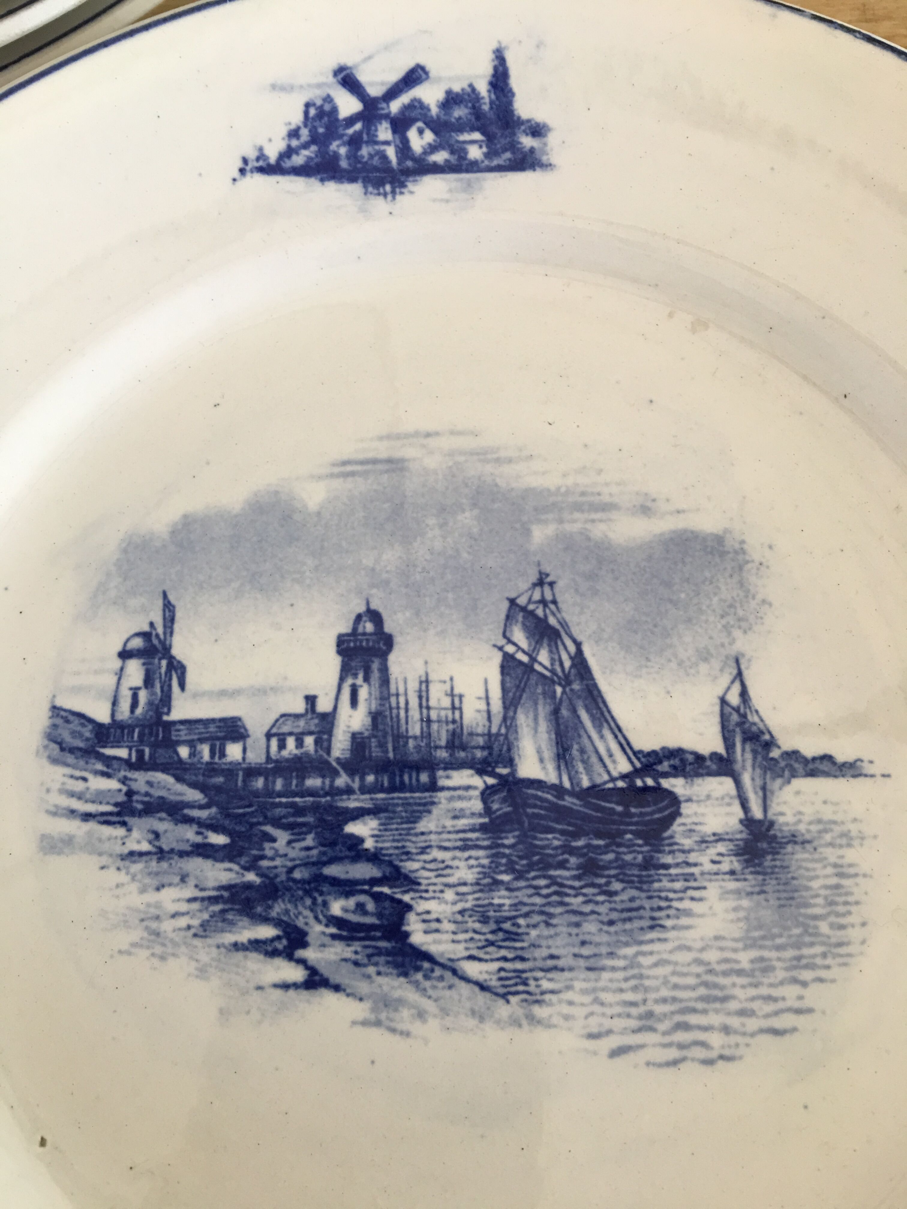 Series of 11 flat plates, Dutch earthenware, early XX