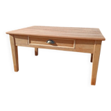 Low farmhouse table in raw wood