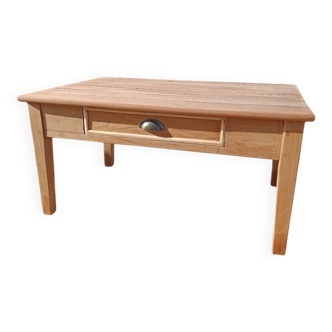 Low farmhouse table in raw wood