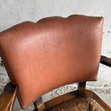 Brutalist dark brown solid wood armchair with natural rattan seat and cognac leather back