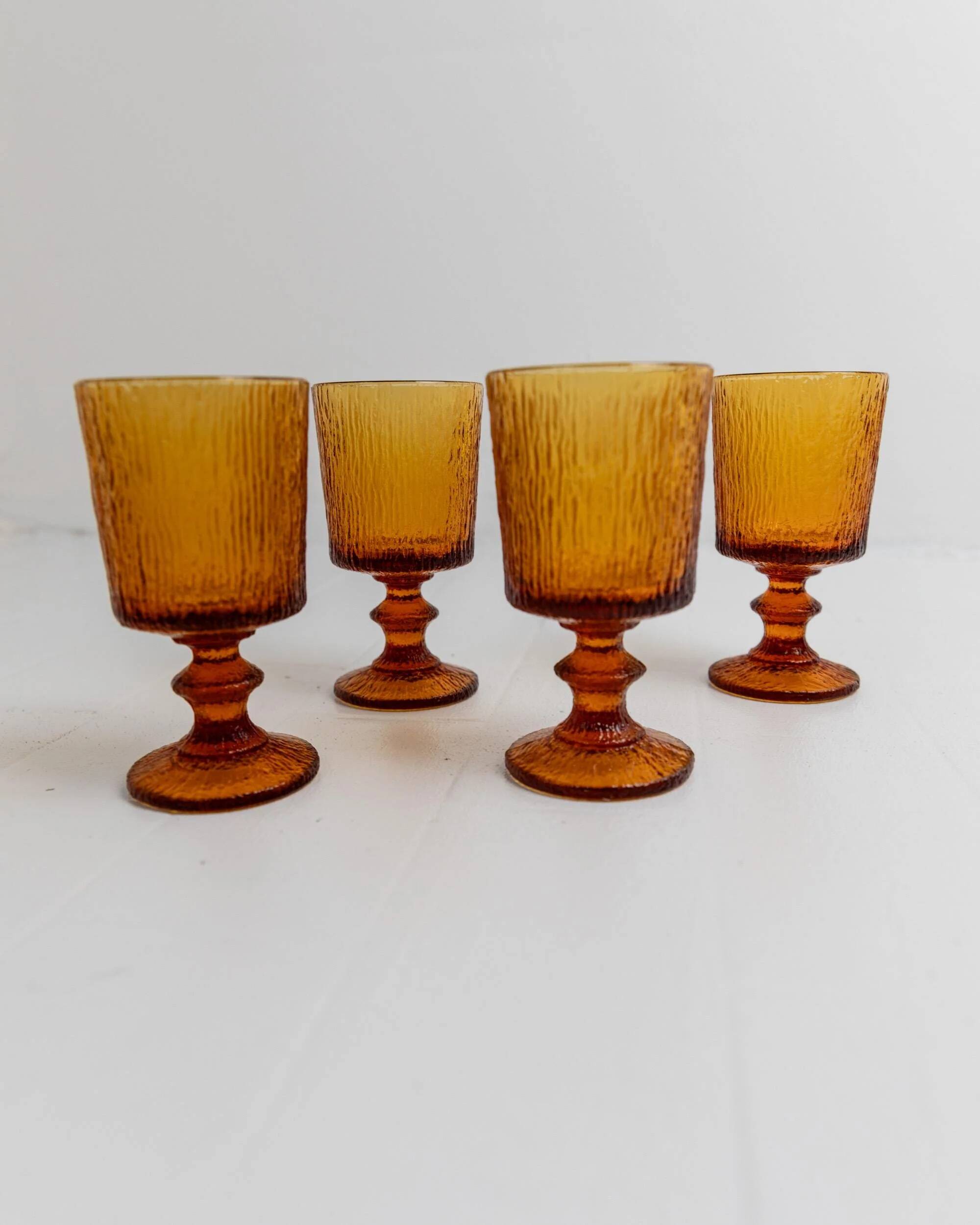 Lot of 4 vintage wine glasses from the 1970s, textured amber on a stem, design by Timo Sarpaneva for Iittala.