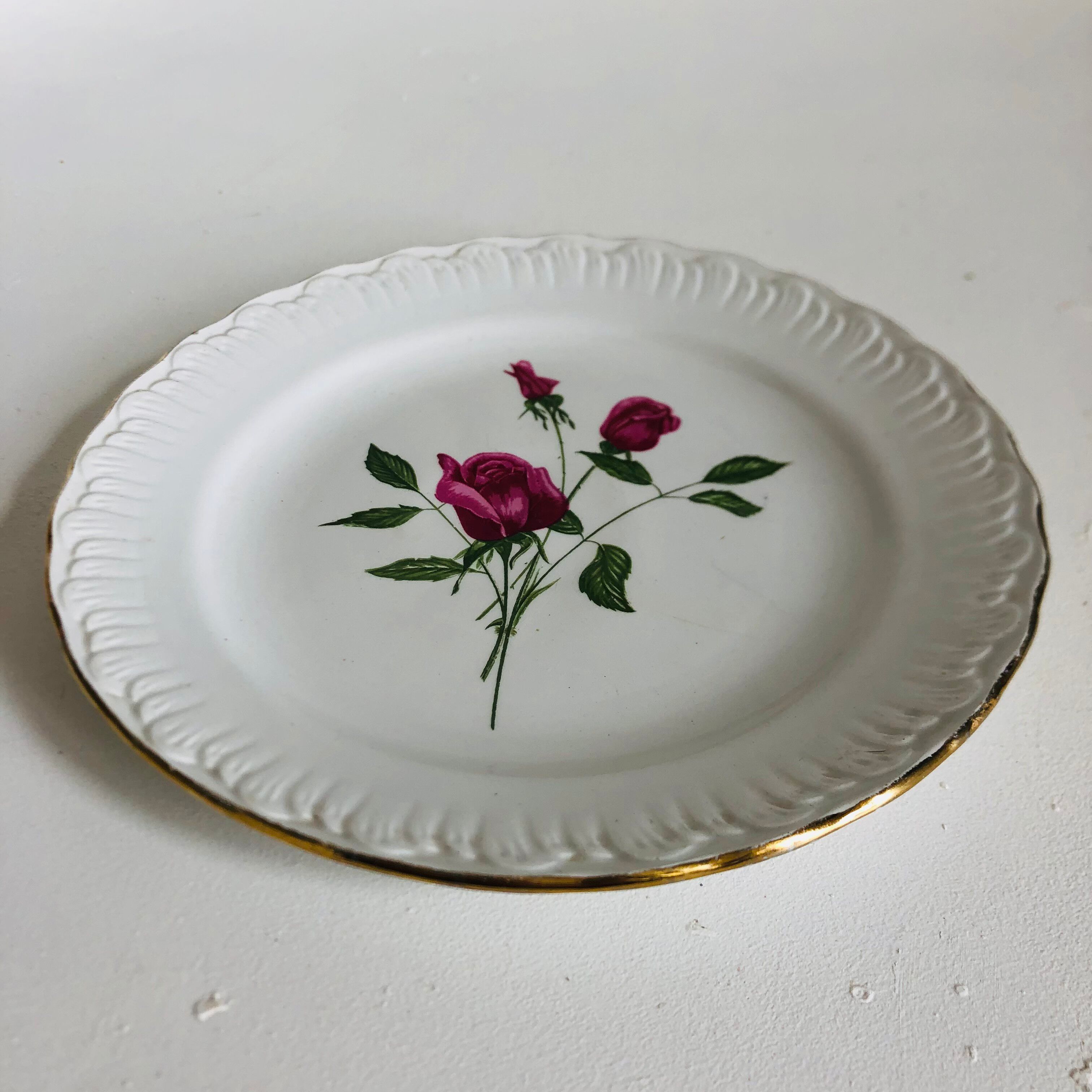 Plate by Amandinoise with a floral art deco rose motif.
