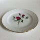 Plate by Amandinoise with a floral art deco rose motif.