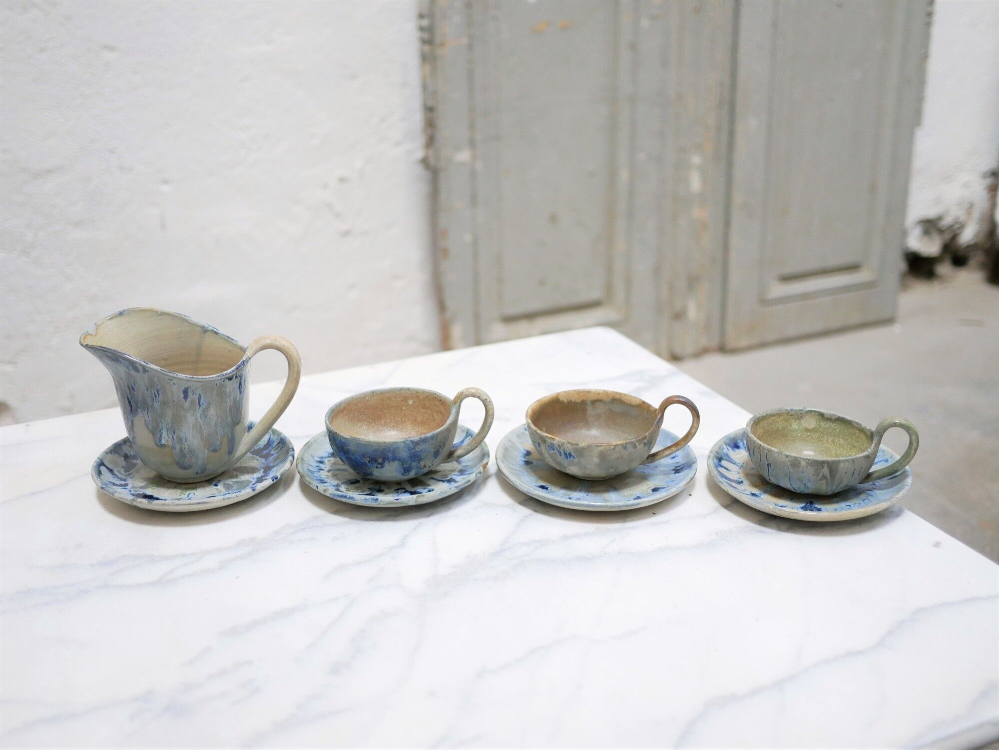 Series of 3 cups, a milk jar and 4 antique porcelain saucers