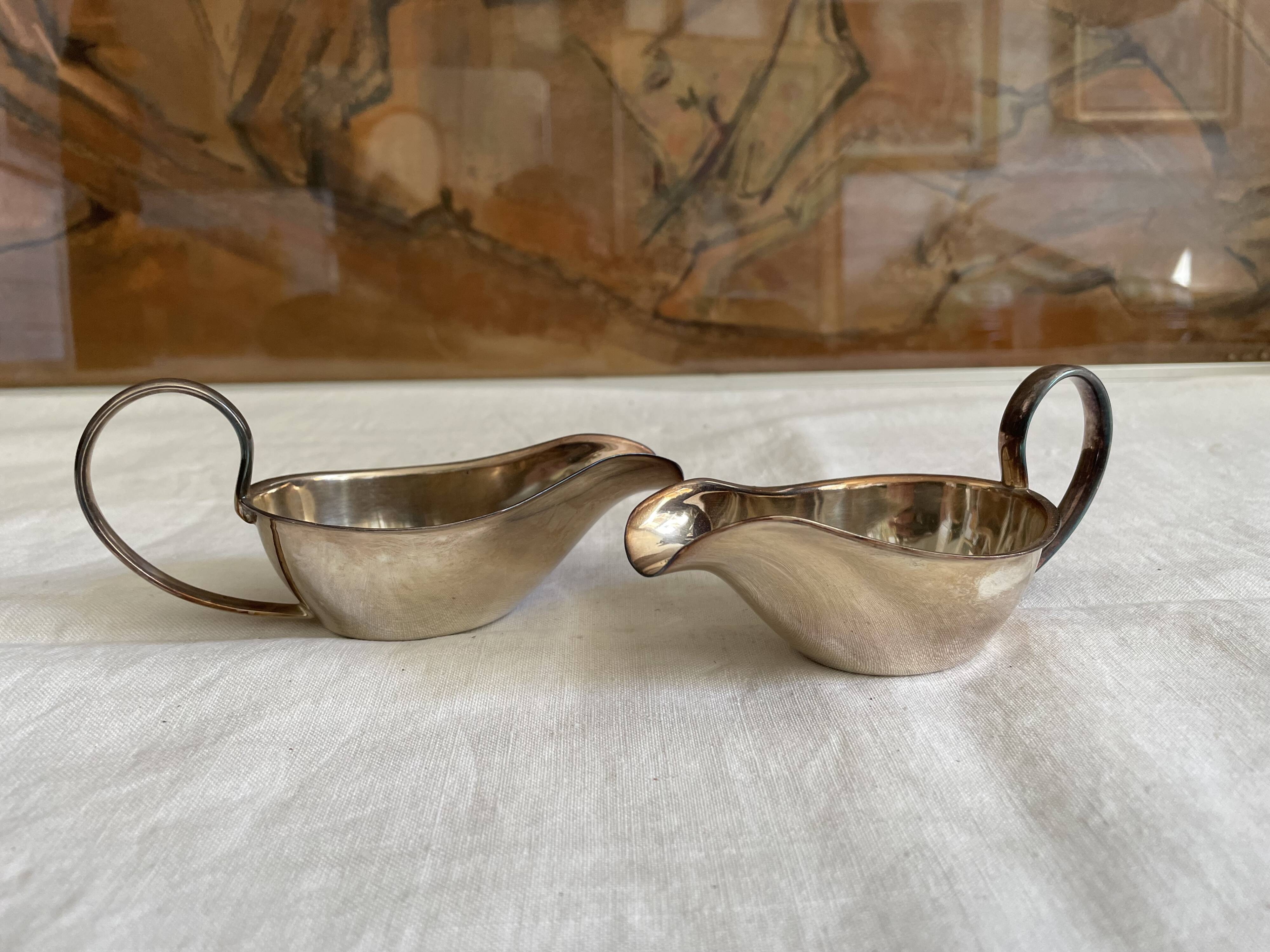 Set of two silver metal saucepans