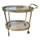 Oval golden brass rolling dessert trolley, Maison Jansen style, 1960s.
