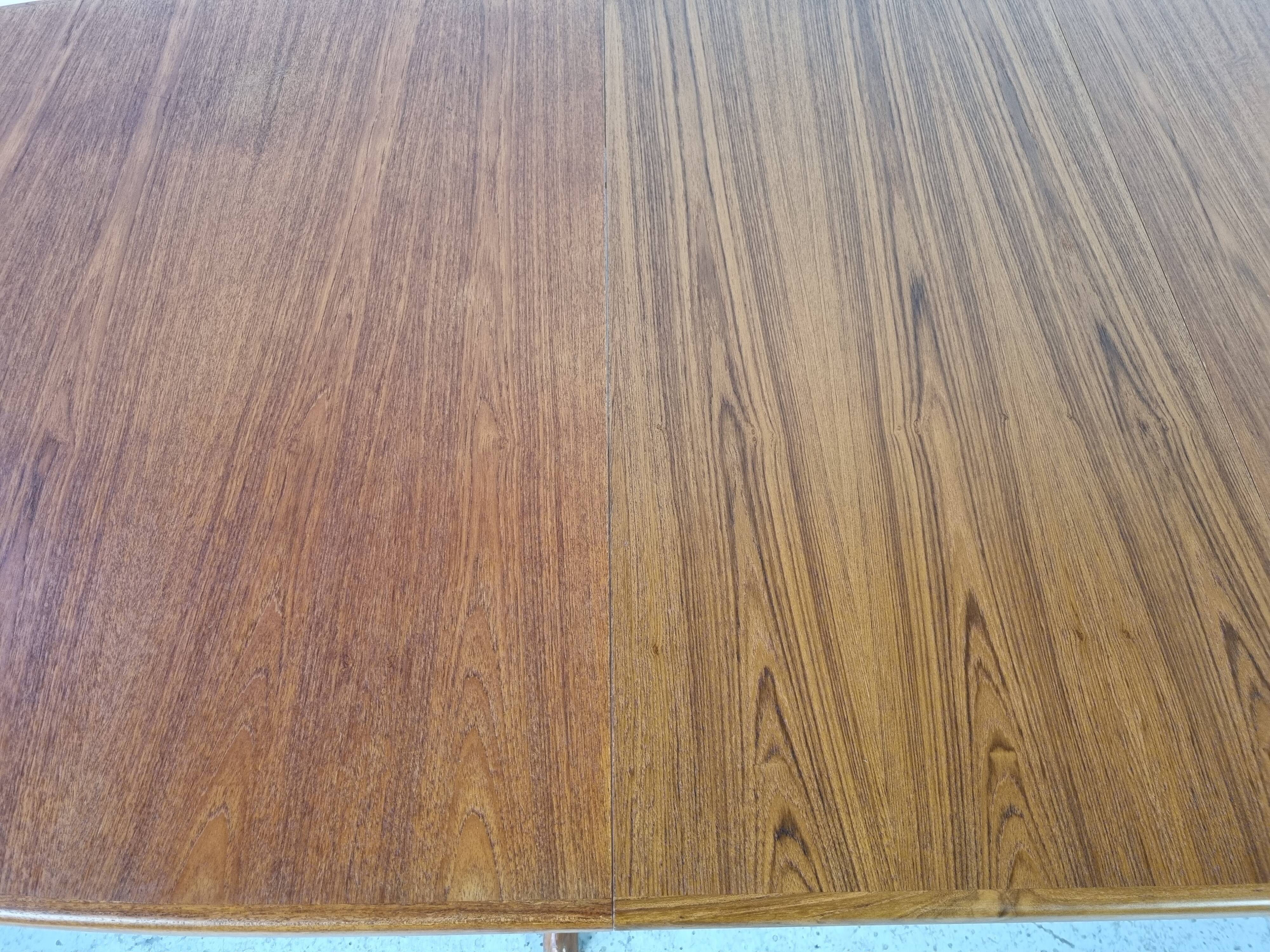 Extendable teak dining table from Dyrlund, Denmark 60s