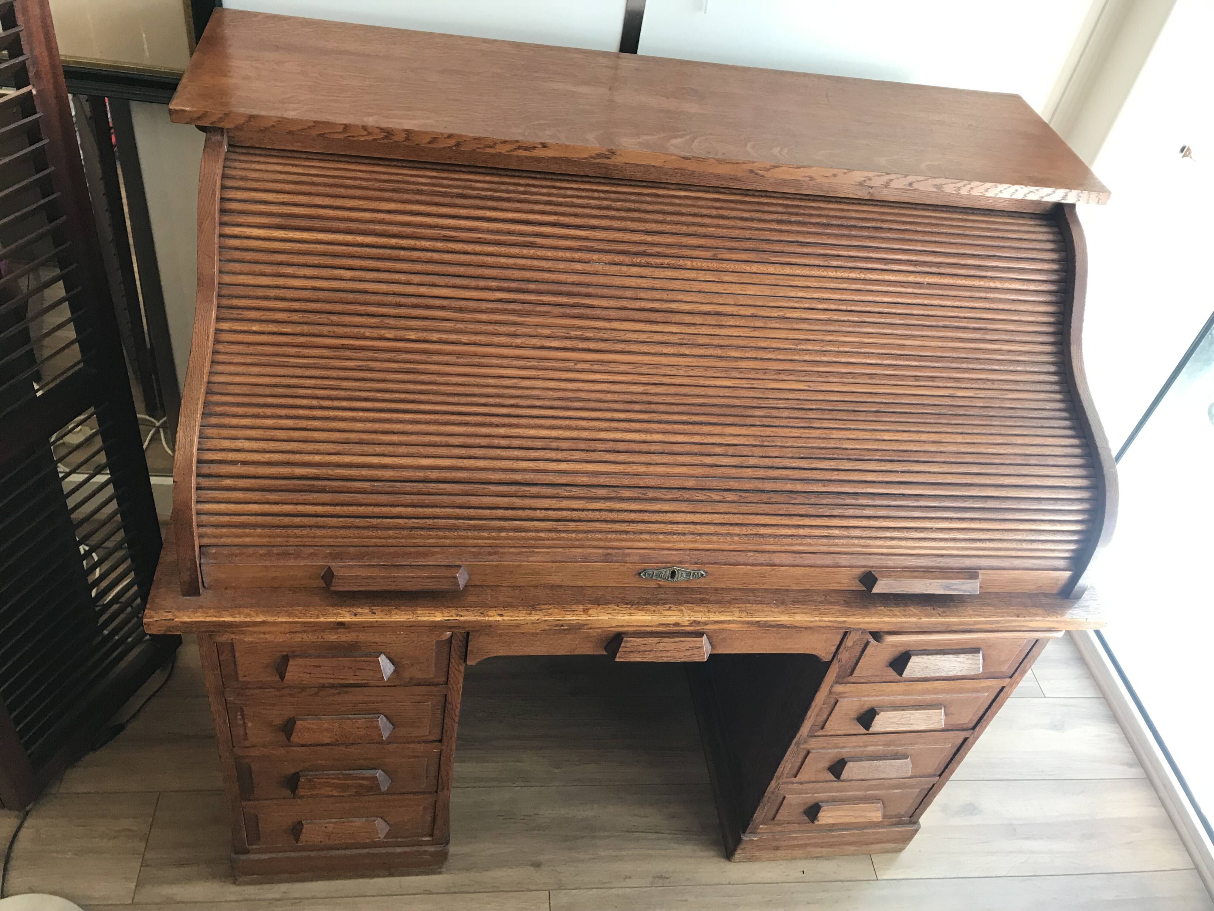 American desk with sliding shutter in solid oak, 20th century