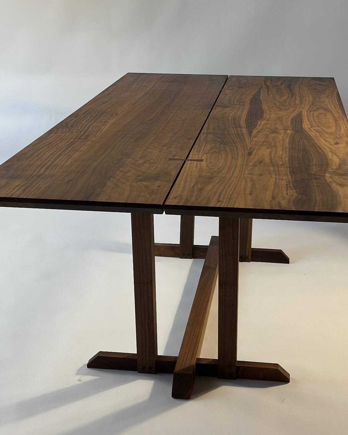 Exceptional dining table in solid walnut.