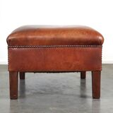 Leather ottoman in classic English style finished with decorative nails