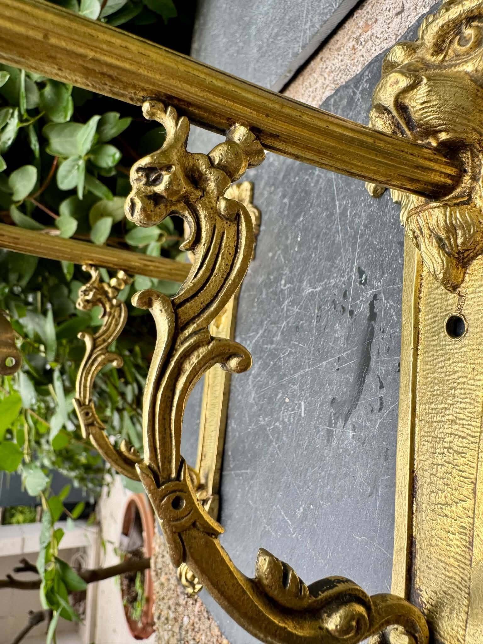 2 brass lion Empire wall sconces
