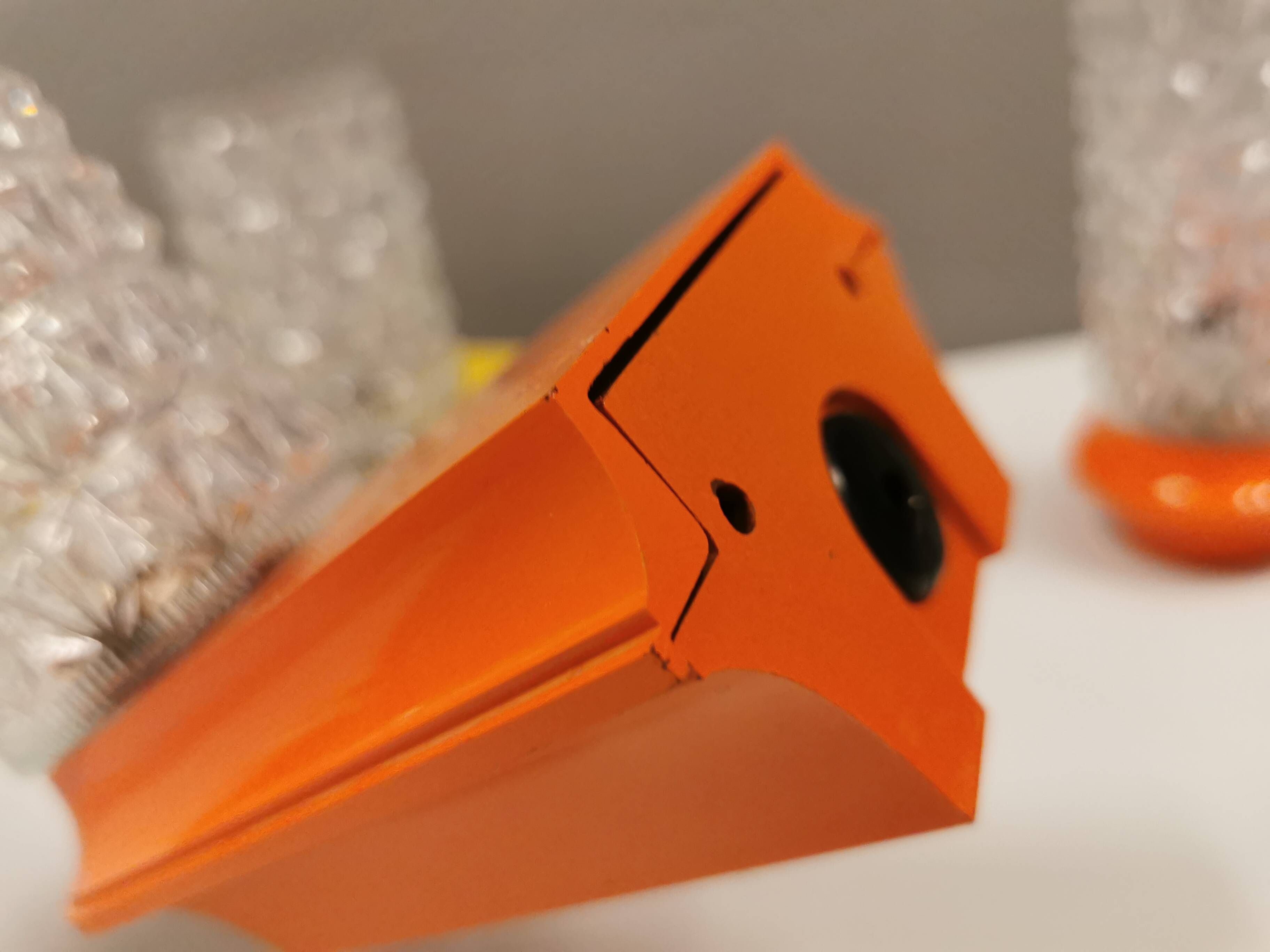 Bathroom lamps in a nice orange colour with a crystal glass shade and a base of hard thin plastic