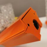 Bathroom lamps in a nice orange colour with a crystal glass shade and a base of hard thin plastic