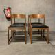 Set of four vintage chairs upholstered in retro design faux leather.