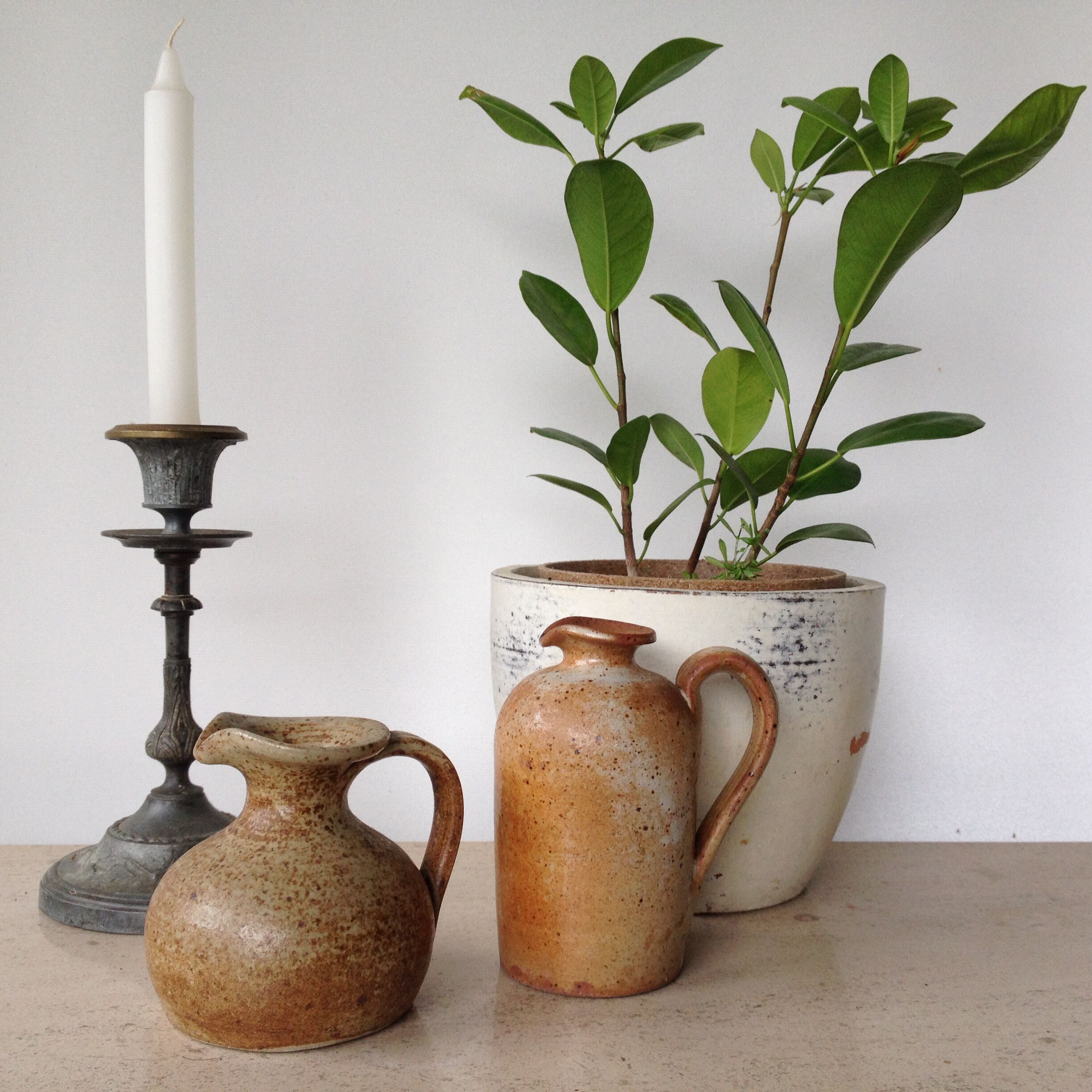 Duo of pitchers in stoneware