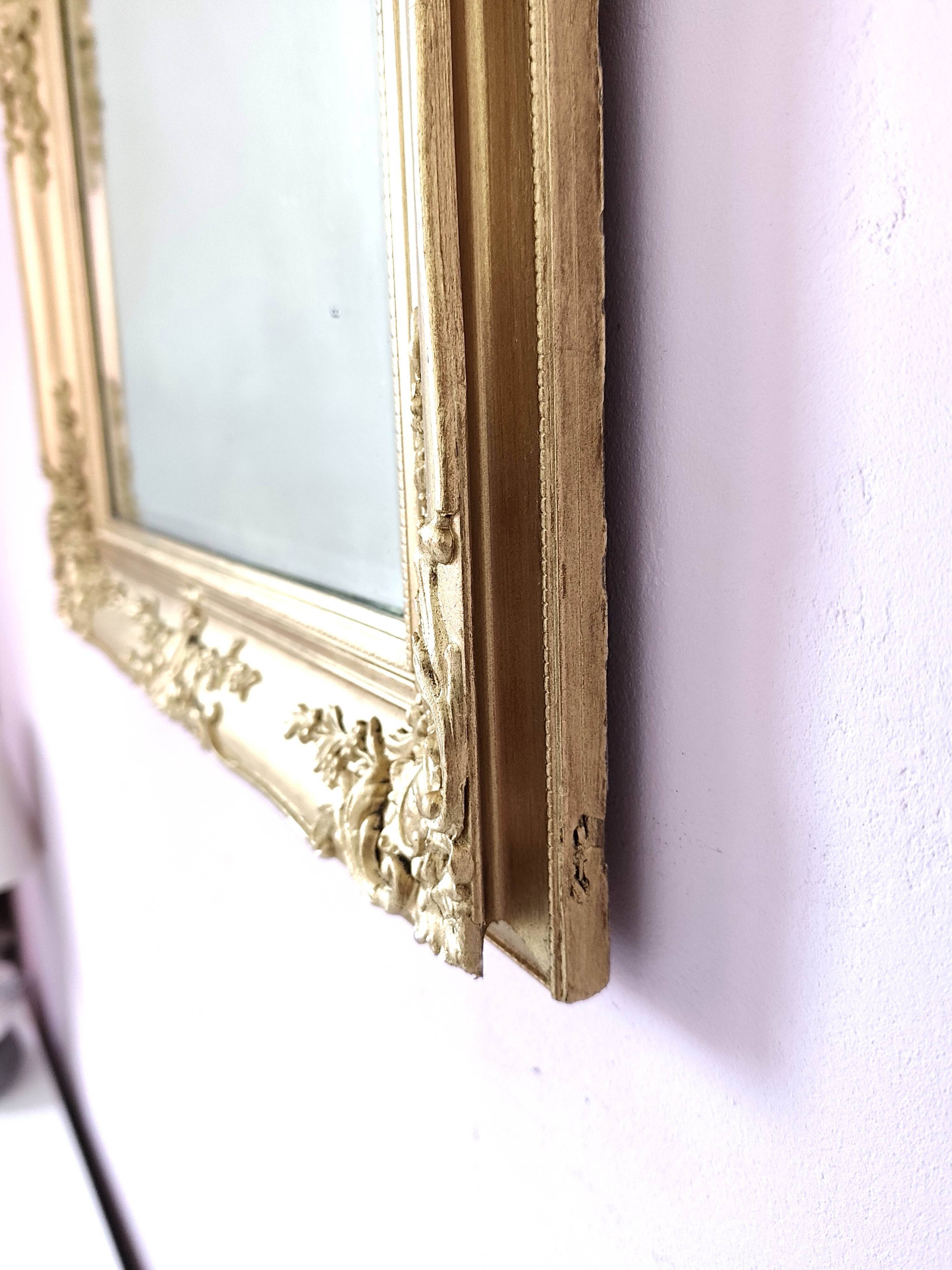 Richly carved antique gilded mirror