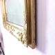 Richly carved antique gilded mirror
