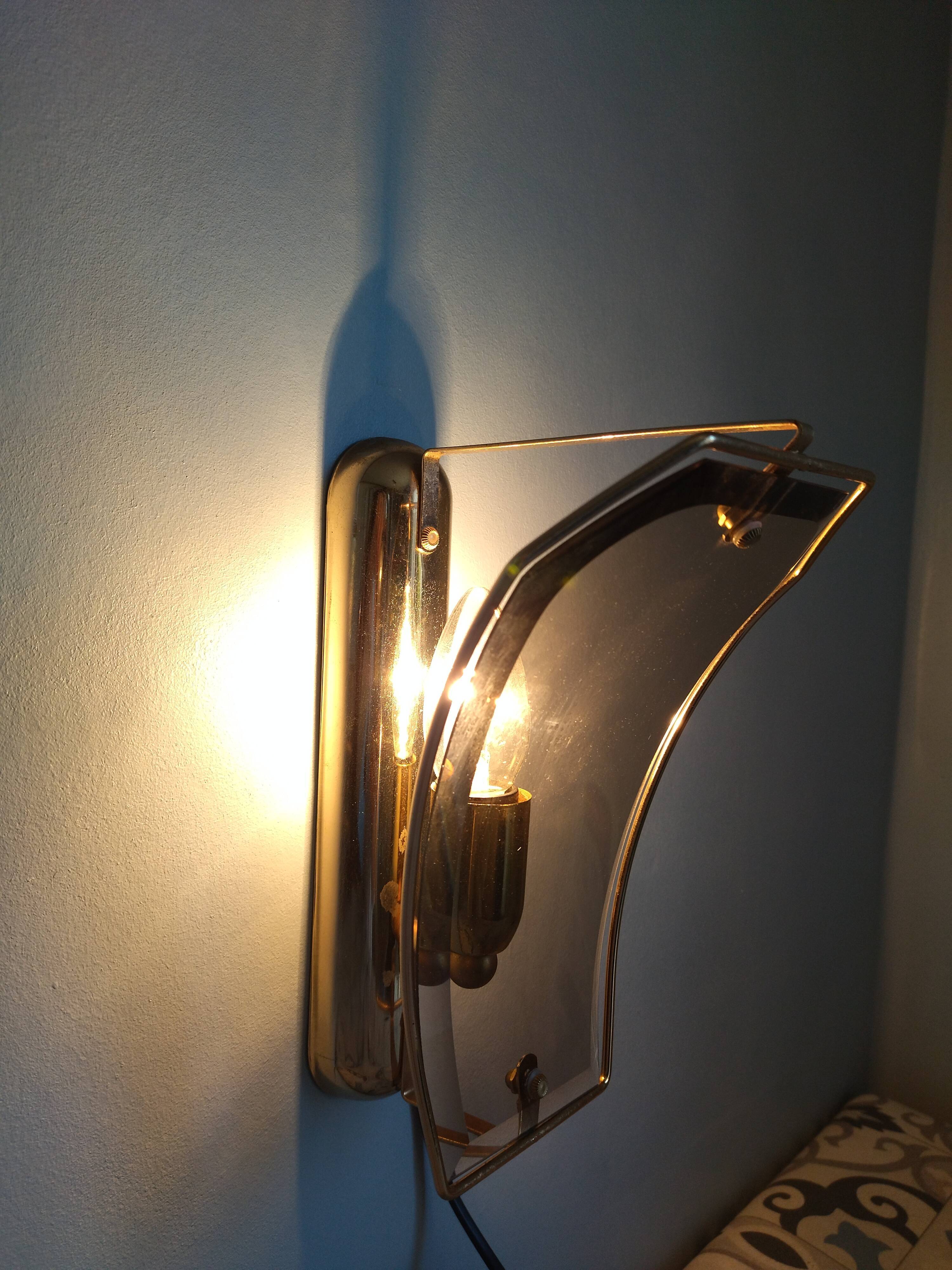 Pair of brass and curved glass wall lamps from the 80s