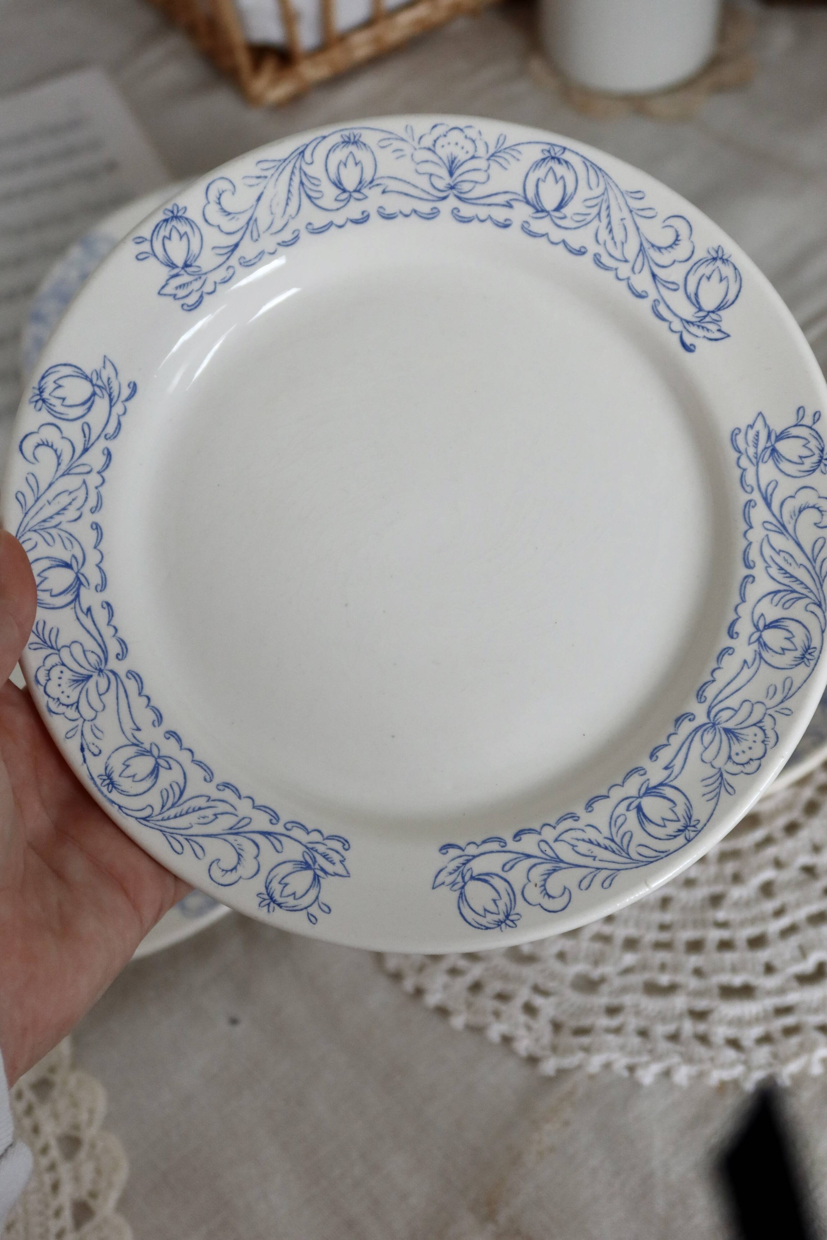 4 vintage porcelain dessert plates with blue border