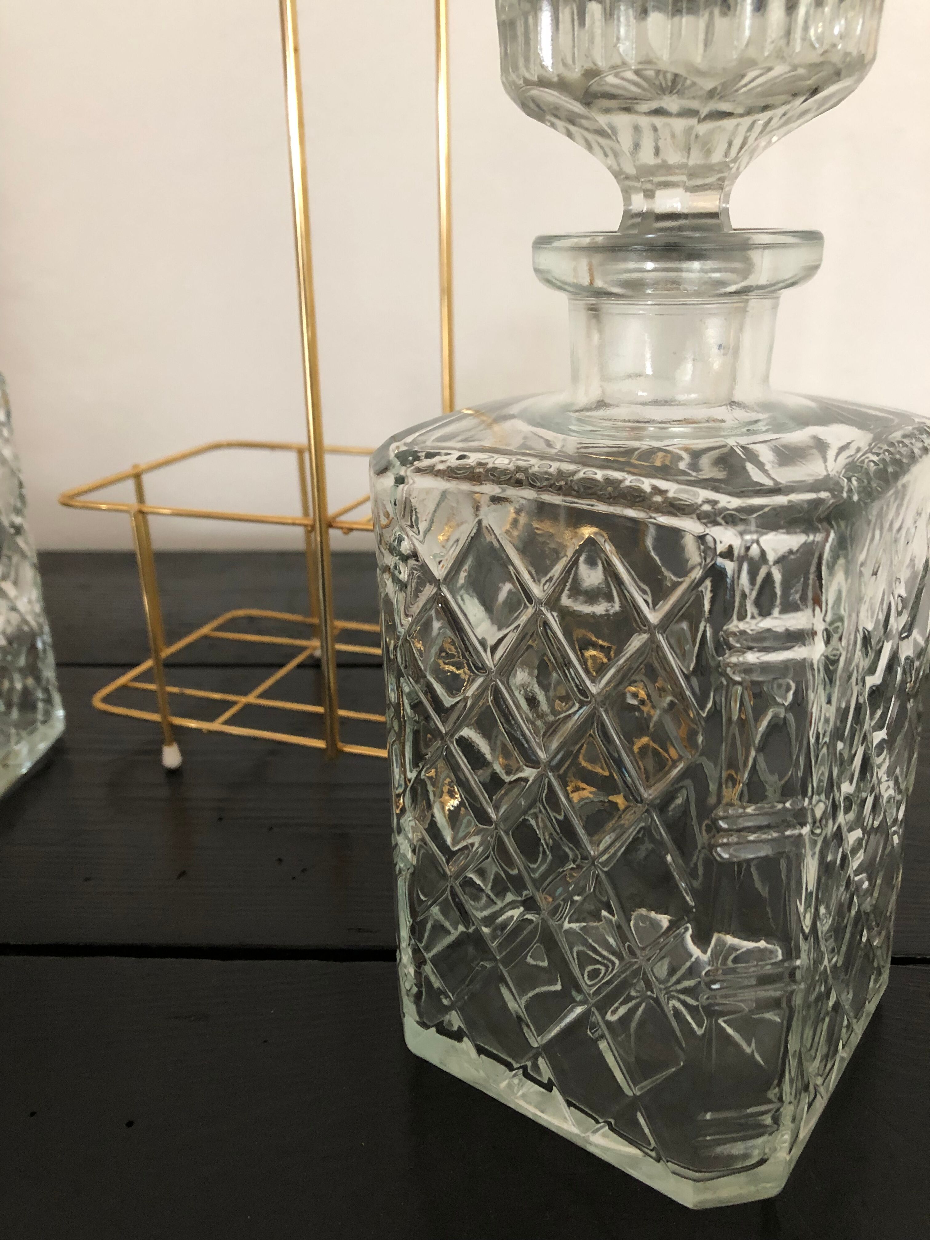 Pair of vintage decanters with brass basket