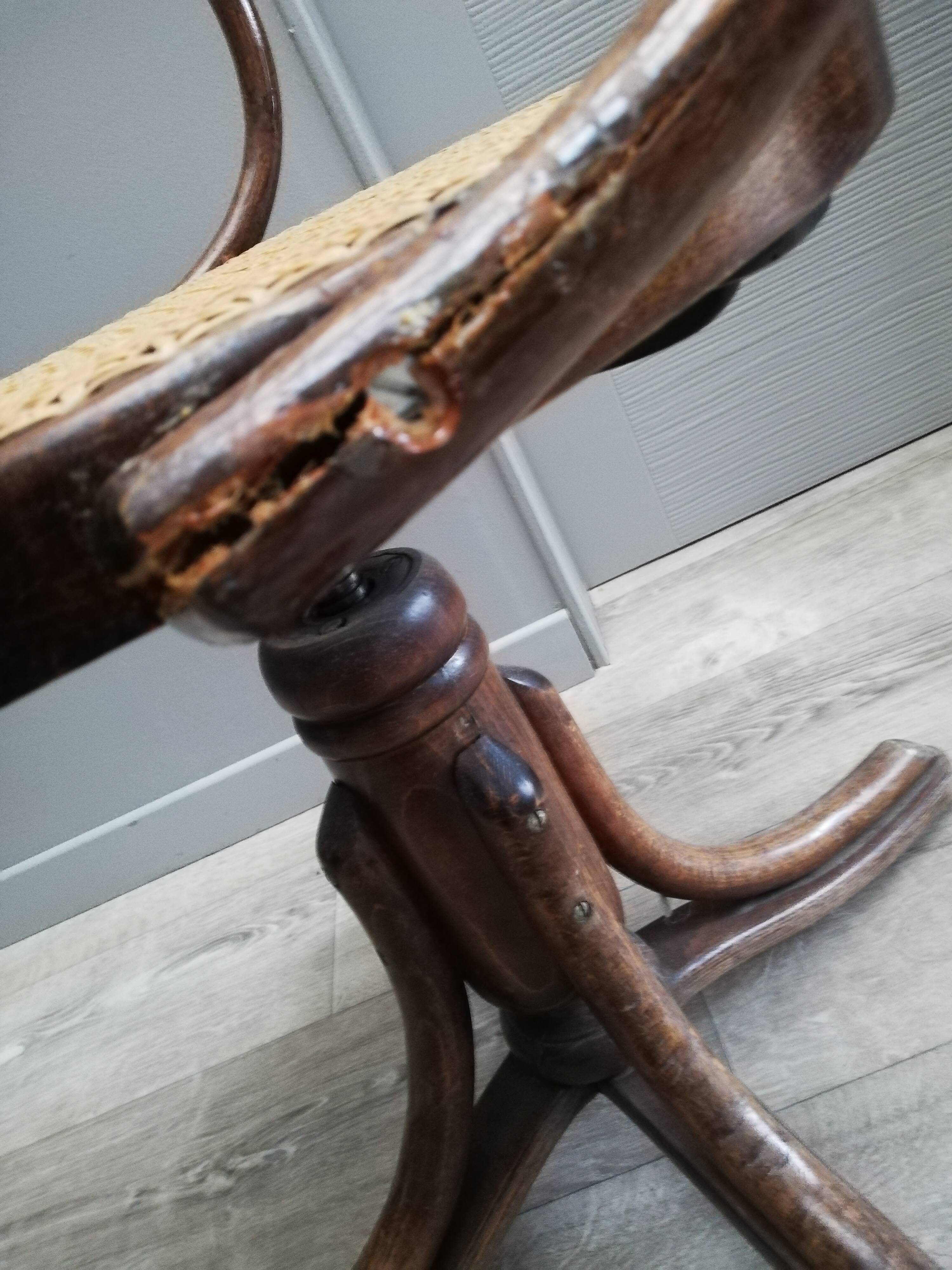Office chair with curved wood swivel screw and Thonet cannage