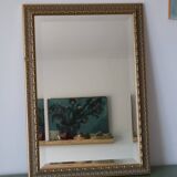 Rectangular gold mirror with moulded decoration.
